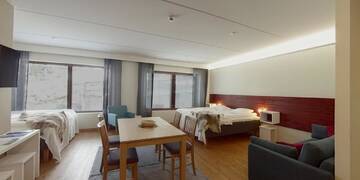 Фото номера Семейный номер с сауной Отель Hotel Arctic Zone г. Рука 3