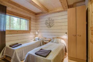Фото номера Коттедж с сауной и 4 спальнями Дома для отпуска Ruka Safaris - Karhun Maja г. Рука 12
