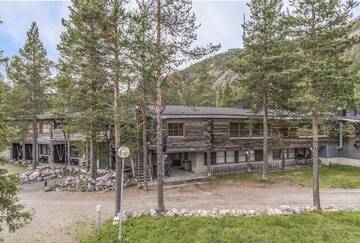 Фото номера Коттедж с сауной и 4 спальнями Дома для отпуска Ruka Safaris - Karhun Maja г. Рука 23