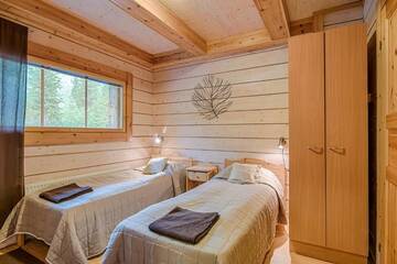 Фото номера Коттедж с сауной и 4 спальнями Дома для отпуска Ruka Safaris - Karhun Maja г. Рука 32
