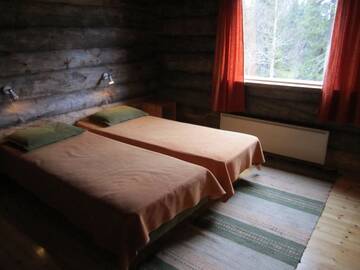 Фото номера Коттедж с 5 спальнями и сауной Дома для отпуска Rukajärven Kelopirtit Cottages г. Рука 14