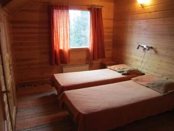 Фото номера Коттедж с 5 спальнями и сауной Дома для отпуска Rukajärven Kelopirtit Cottages г. Рука 35