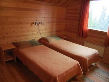 Фото номера Коттедж с 5 спальнями и сауной Дома для отпуска Rukajärven Kelopirtit Cottages г. Рука 34